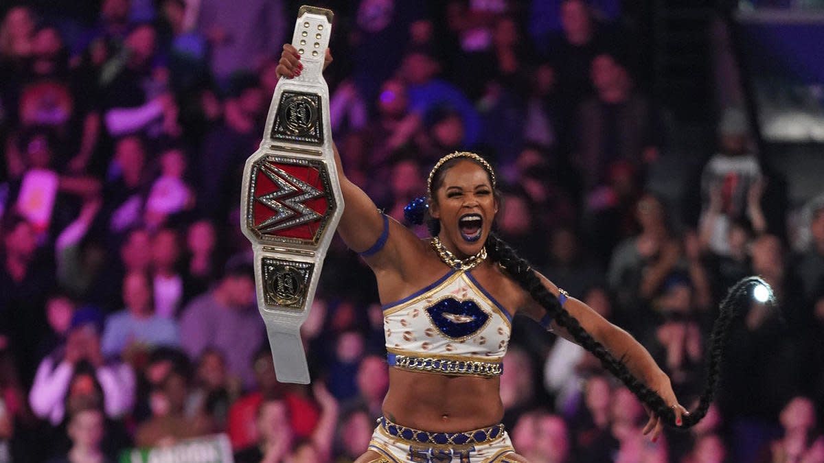 WWE wrestler Bianca Belair holding the Raw Women's Championship
